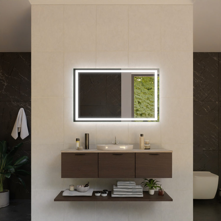 Rectangular LED bathroom mirror with glowing frame above the sink and countertop