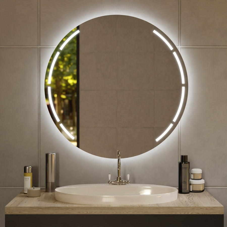 Round LED-lit mirror with glowing ring above a white oval sink and chrome faucet