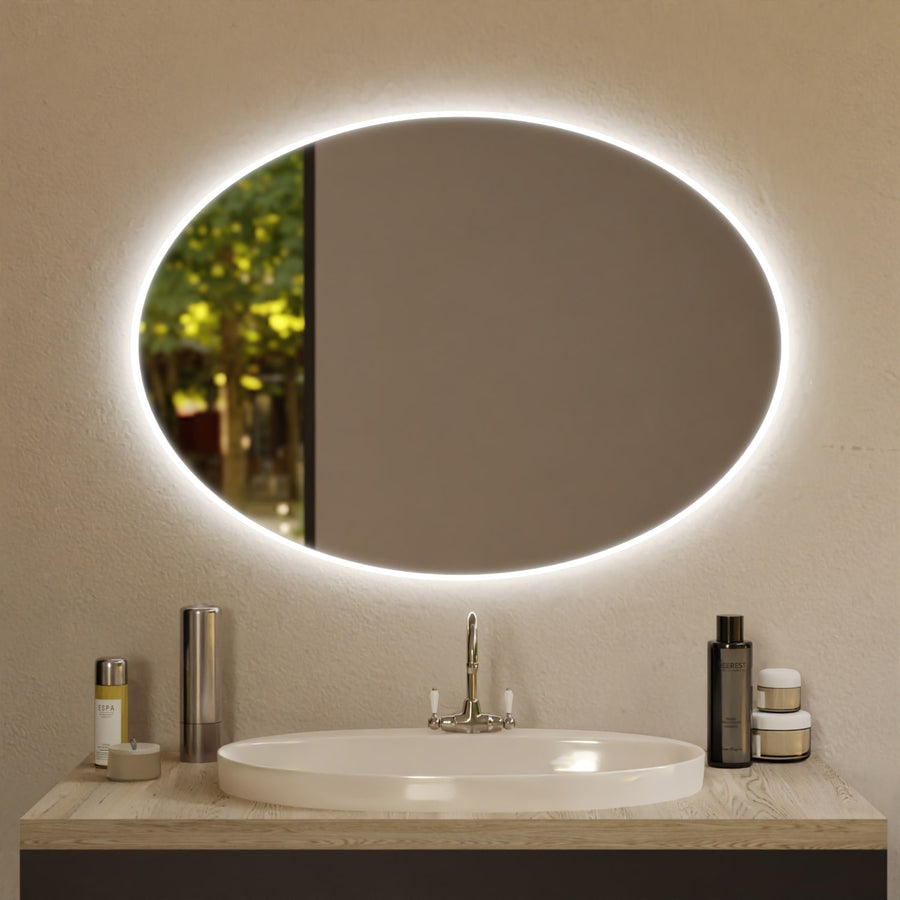Ovaler Wandspiegel mit LED-Leuchtring über ovalem Waschbecken