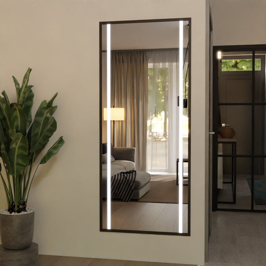 Vertical wall mirror with dark frame and bright LED strip border