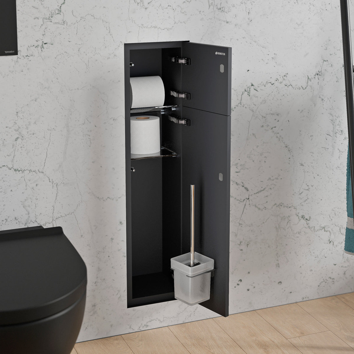 Schwarzes WC-Einbaumodul mit geöffneten Fächern für Toilettenpapier und Bürste